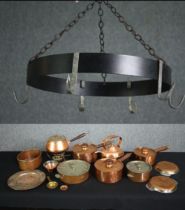 An early 20th century kitchen pot hanger, copper pans and pots and a fondue pan.