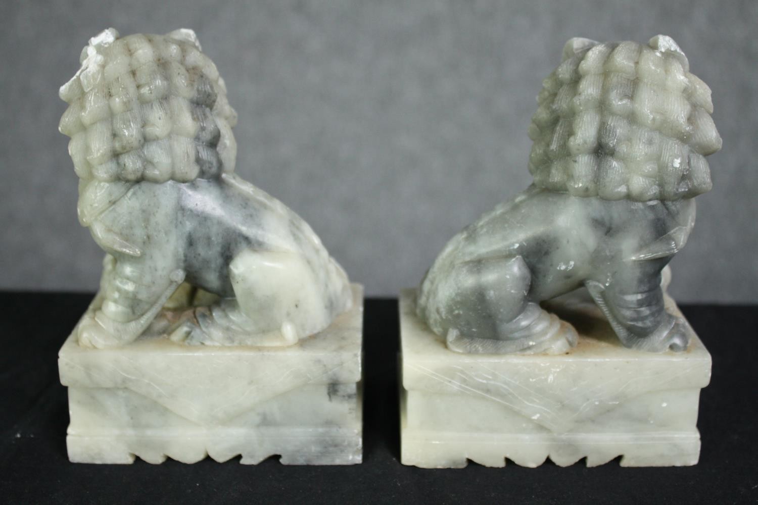 A pair of Chinese carved soapstone foo dogs. H.14cm. (each). - Image 6 of 6