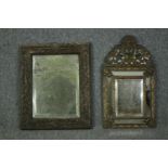 A 19th century Dutch wall mirror with repousse brass cushion frame and a 19th century distressed