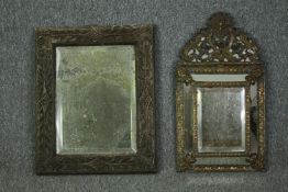 A 19th century Dutch wall mirror with repousse brass cushion frame and a 19th century distressed