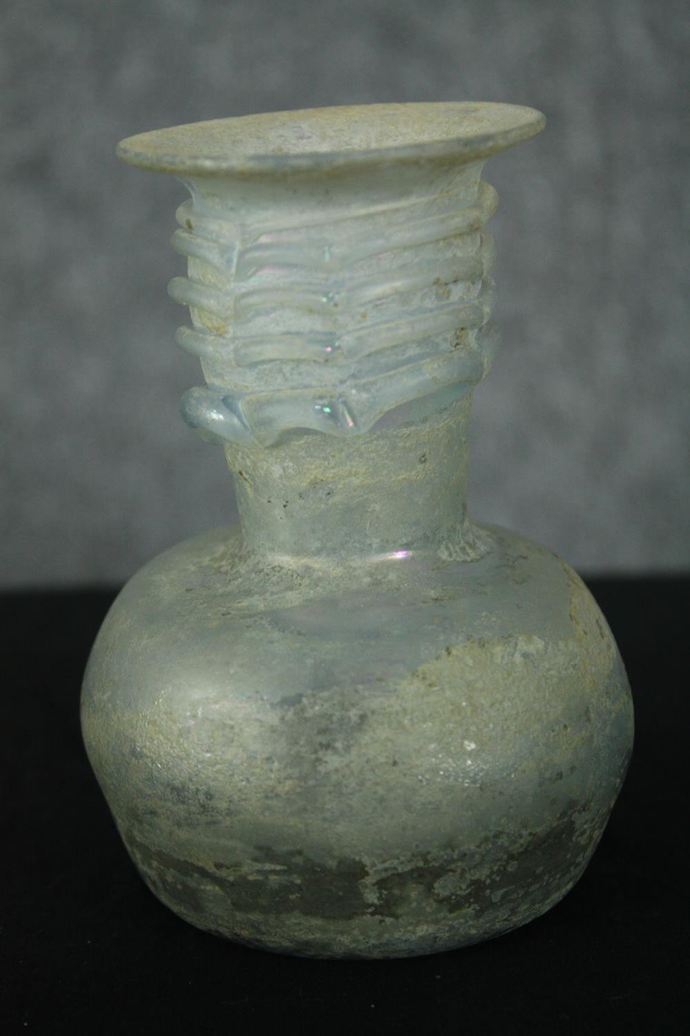 A Roman iridescent glass oil jug. H.12cm. - Image 3 of 8