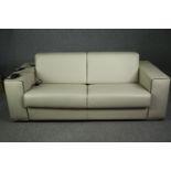 A contemporary Italian sofa bed by Giannini design in piped leather with motorized action. 4' 6"