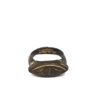 A bronze Roman ring with elliptical shape and hand etched geometric design. Ring size P. Weight 8.