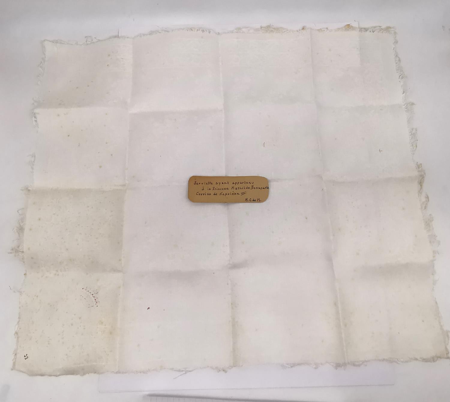 A hand embroidered napkin deemed to be used by Napoleon Bonaparte III cousin Princess Mathilde