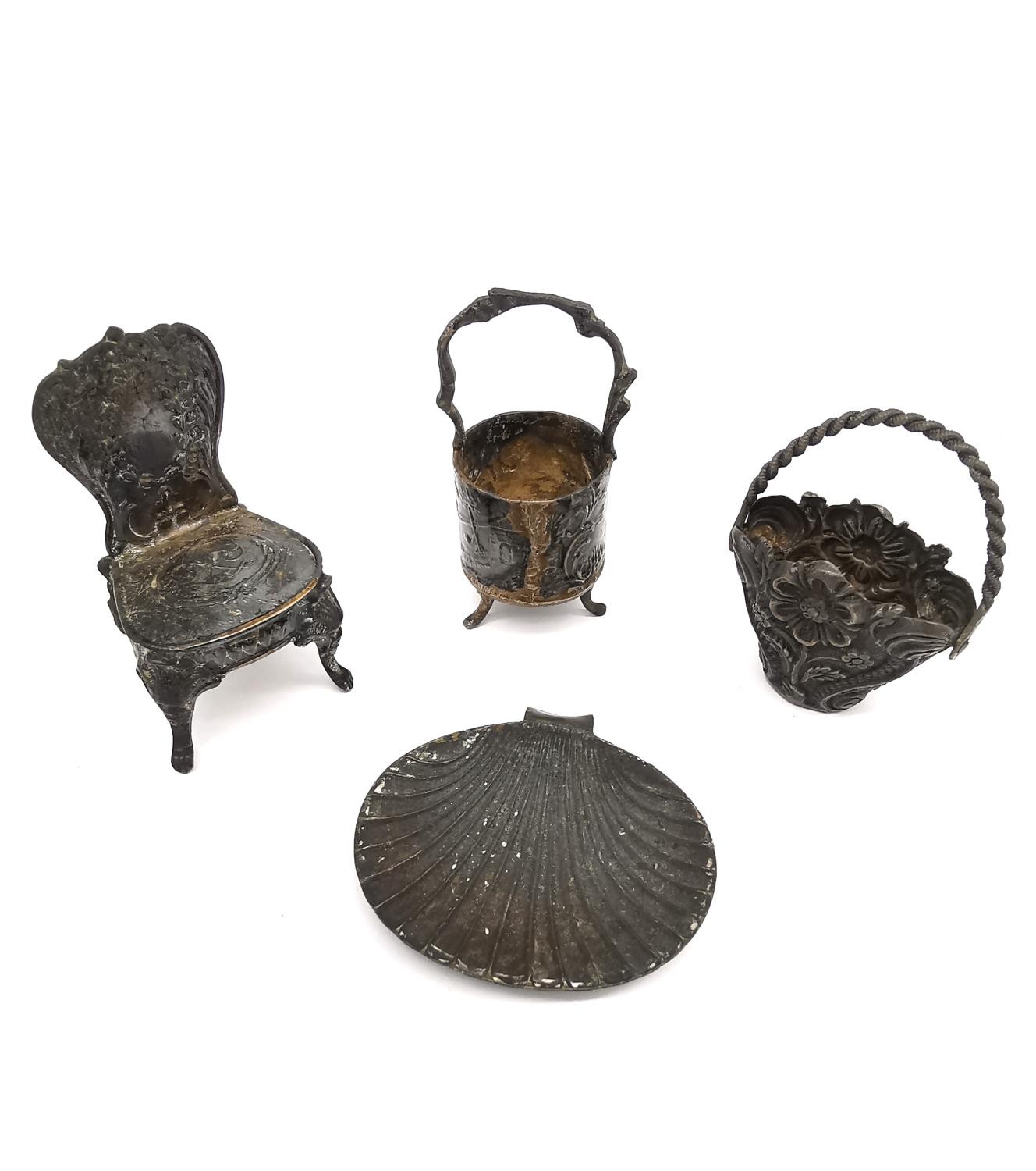 Three silver miniatures to include a repousse chair by John George Piddington, a white metal