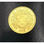 A 20F Swiss gold coin dated dated 1898. Diameter 2.1cm. Weight 6.44g.