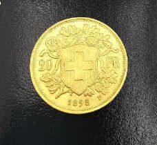 A 20F Swiss gold coin dated dated 1898. Diameter 2.1cm. Weight 6.44g.