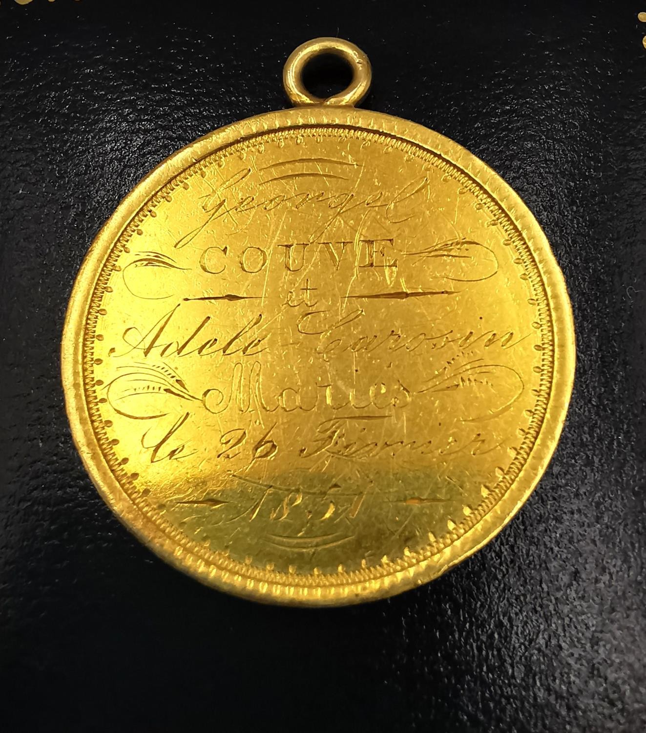 A 19th century yellow metal (tests higher than 9ct) medal with laurel leaf wreath and engraved