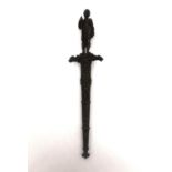 A 19th century French colonial bronze handled dagger with relief design bronze scabbard. The