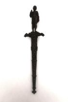 A 19th century French colonial bronze handled dagger with relief design bronze scabbard. The