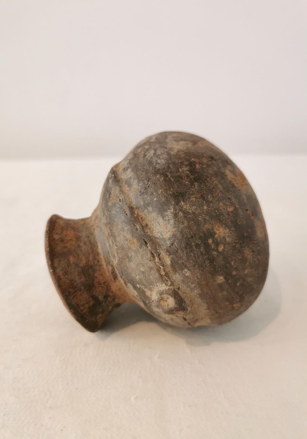 A Pre-Colombian terracotta vessel with rounded bottom and two small protrusions on the side. H.9.5 - Image 6 of 6