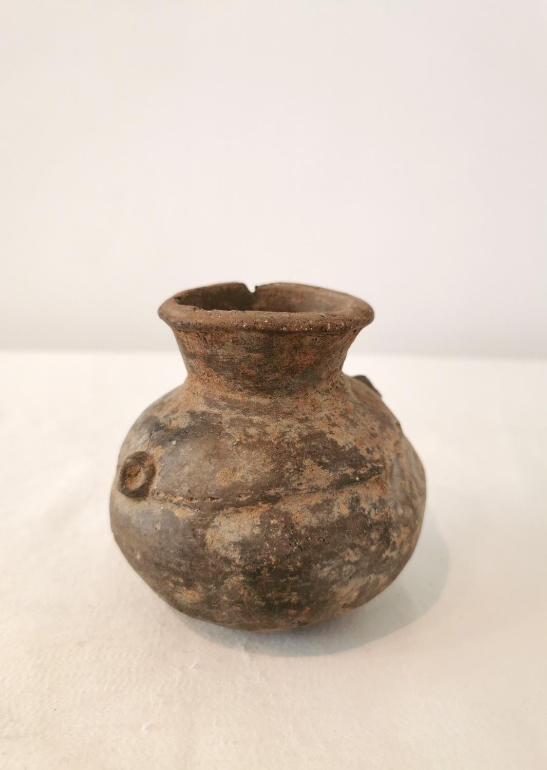 A Pre-Colombian terracotta vessel with rounded bottom and two small protrusions on the side. H.9.5 - Image 3 of 6