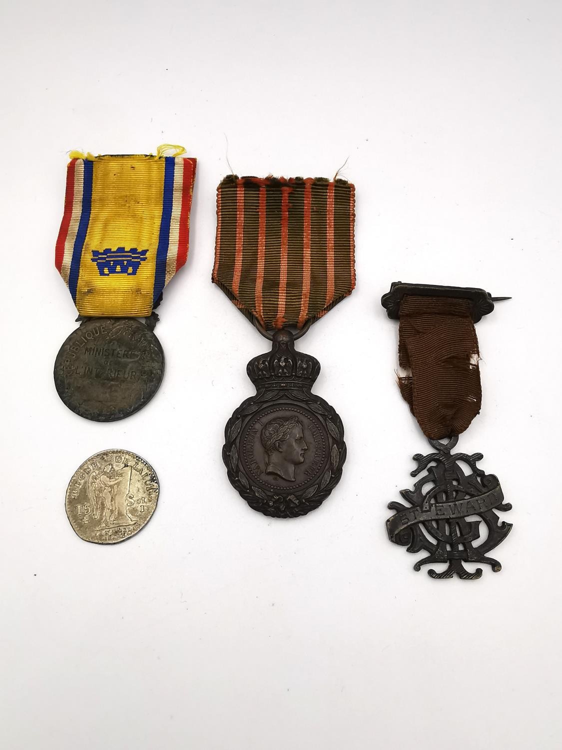 Three French medals and one coin, an Octroi medal of Merit, Bronze, a French St Helena campaign