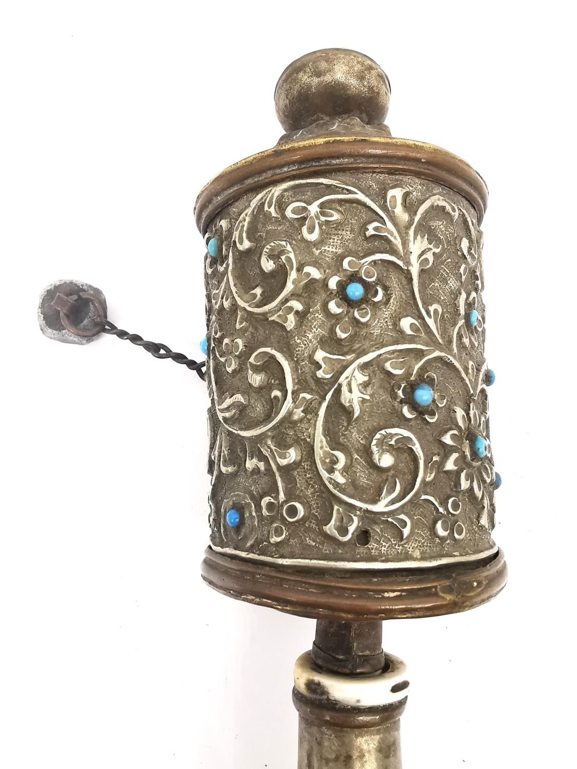 A Tibetan 19th century brass and copper repousse prayer wheel with hardwood handle. H.31cm. - Image 2 of 5