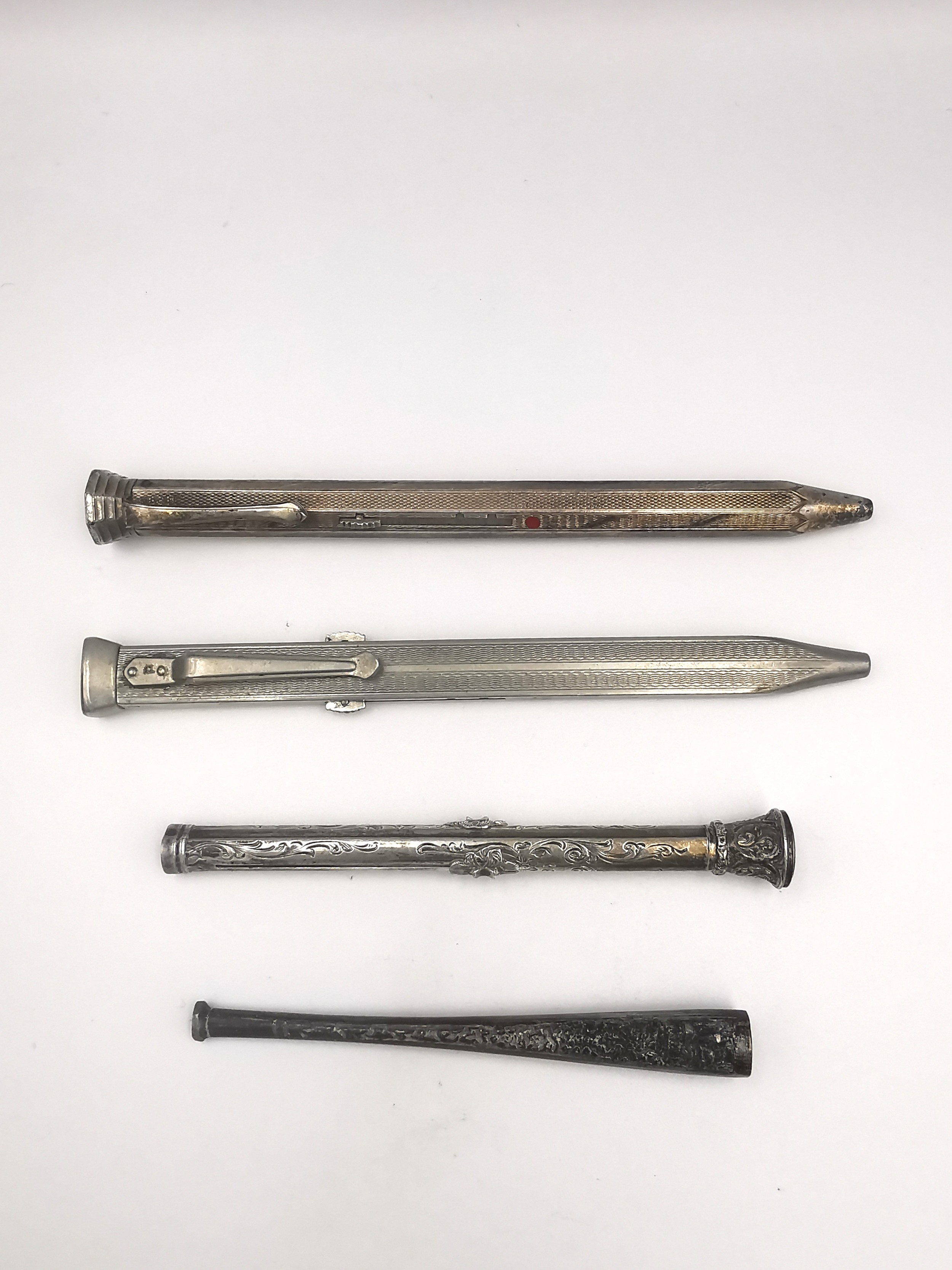 A white metal (tests as silver) repousse cheroot holder, a white metal (tests as silver) repousse - Image 2 of 3