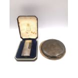 A cased silver Dunhill lighter, marked Made in Switzerland, Dunhill, London with patent LIC USA