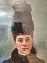 A 19th century oil on canvas on board portrait of a Russian lady in hat and fur collar coat.