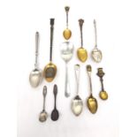 A collection of eleven 19th century silver, white metal and silver plated souvenir spoons of various