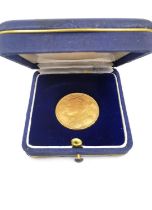 A silk cased 20F Swiss gold coin dated 1947. Diameter 2.1cm Weight 6.44g.