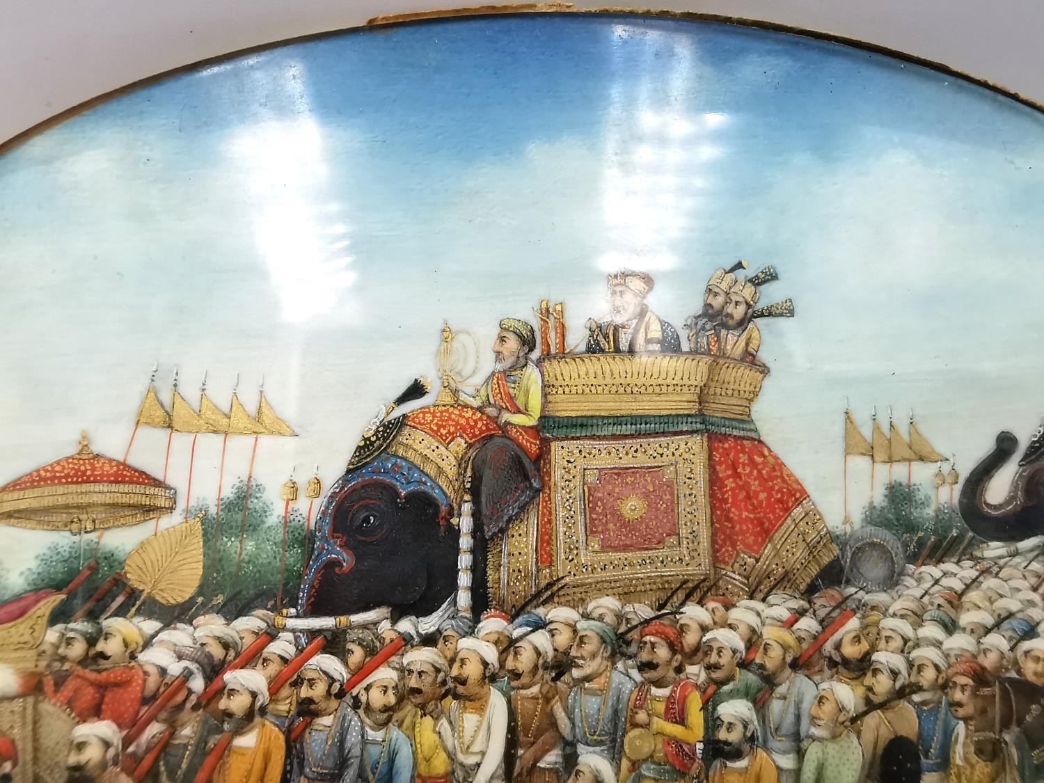 A 19th century Indian Mughal oval miniature on ivory of a royal procession, Akbar Shah II on - Image 7 of 8