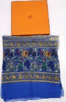 A boxed Hermes 'Chasse en Inde' (blue border) silk scarf by Michel Duchene, 1986. 132x112cm