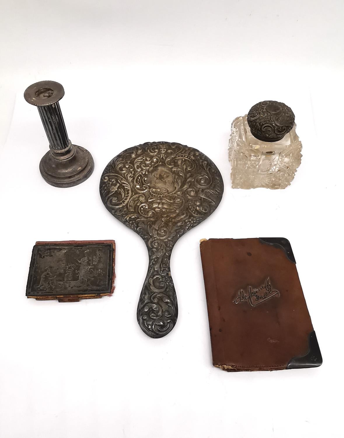 A collection of silver and silver plate, including a cut glass and repousse silver inkwell with