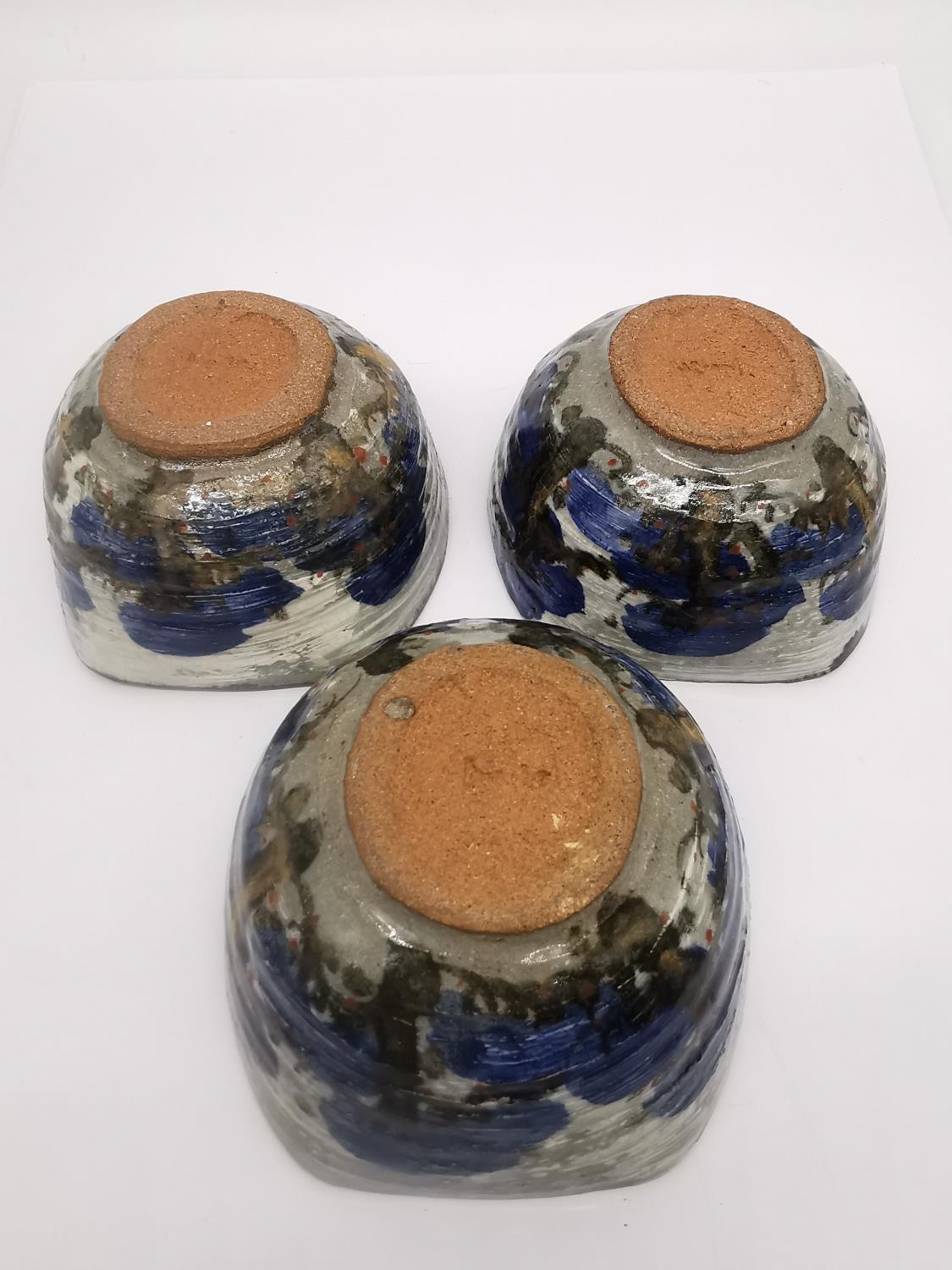 Three Japanese pottery bowls with abstract blue trees on grey ground of squared off form along - Image 4 of 7