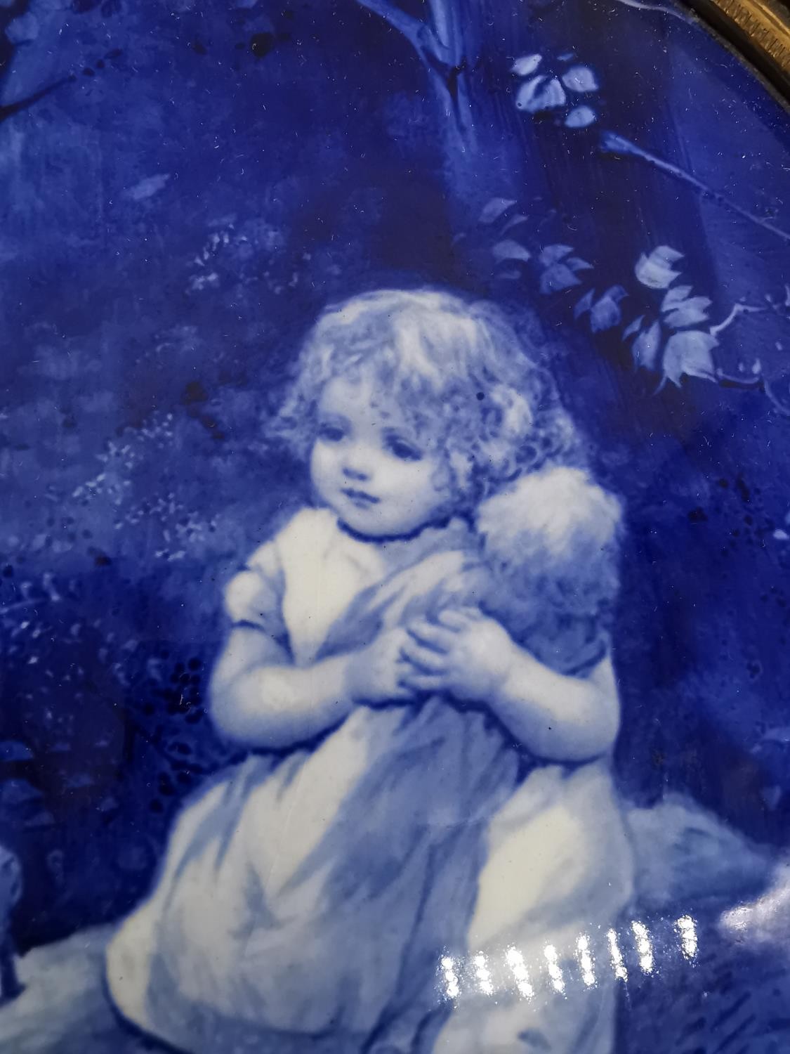 A framed 19th century Royal Doulton oval blue and white ceramic wall plaque decorated with girl with - Image 2 of 5