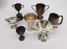 A collection of five silver trophy cups, a tankard and a silver beaker. The French silver beaker