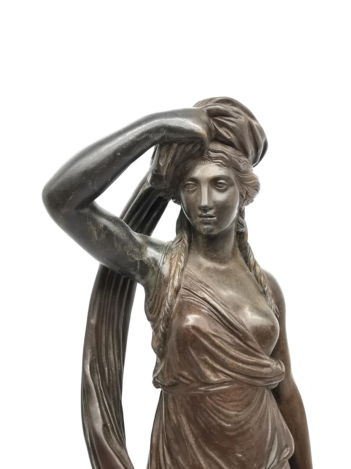 A 19th century bronze sculpture of a classical lady in draping robes removing her head cloth, - Image 2 of 8