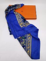 A boxed Hermes 'Chasse en Inde' (blue border) silk and cashmere scarf the by Michel Duchene, 1986.