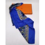 A boxed Hermes 'Chasse en Inde' (blue border) silk and cashmere scarf the by Michel Duchene, 1986.