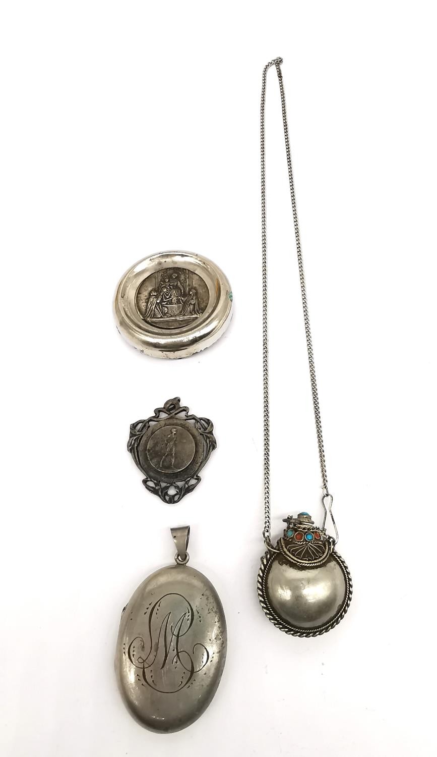 A white metal perfume flask with coral and turquoise detailing on chain, a locket containing plaited
