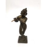 A 19th century Indian bronze figure of Krishna in Tri-bhang stance and playing the flute. H.12.5cm.