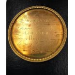 A 19th century French yellow metal (tests higher than 9ct gold) medal with raised edge and inscribed