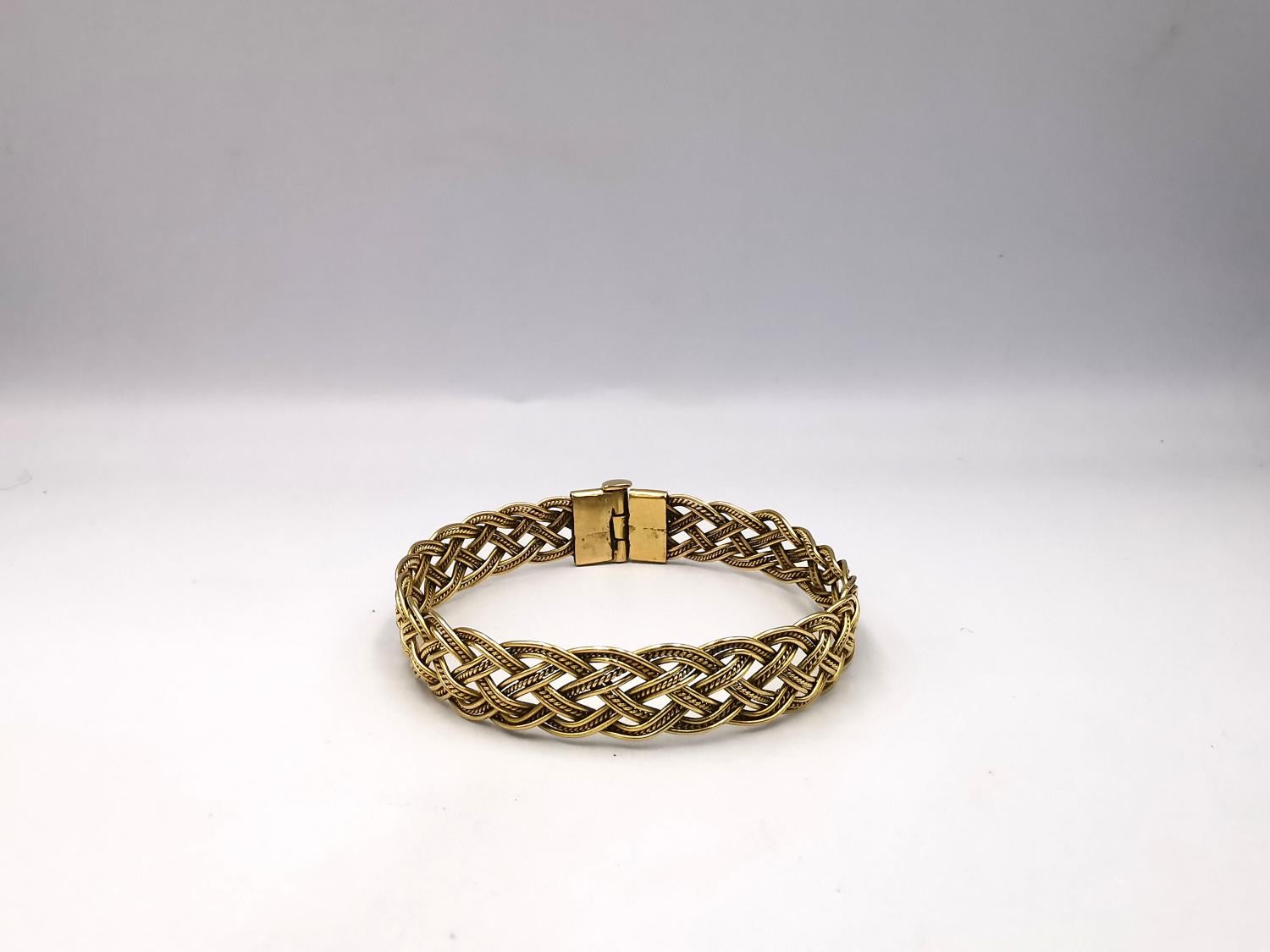 A woven gold plated wirework plaited bracelet with pin fastening. Diameter 6cm. Weight 18.62g. - Image 4 of 10