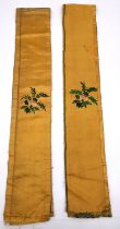 A pair of 20th century Chinese yellow silk sleeve panels embroidered with pine trees, birds,