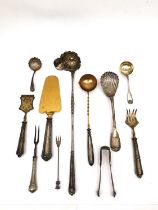 A collection of silver and silver plate, to include a silver punch ladle, a shell design caddy