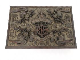 An early 20th century carved hard wood Chinese cigar box. Decorated with heraldic shield and motto