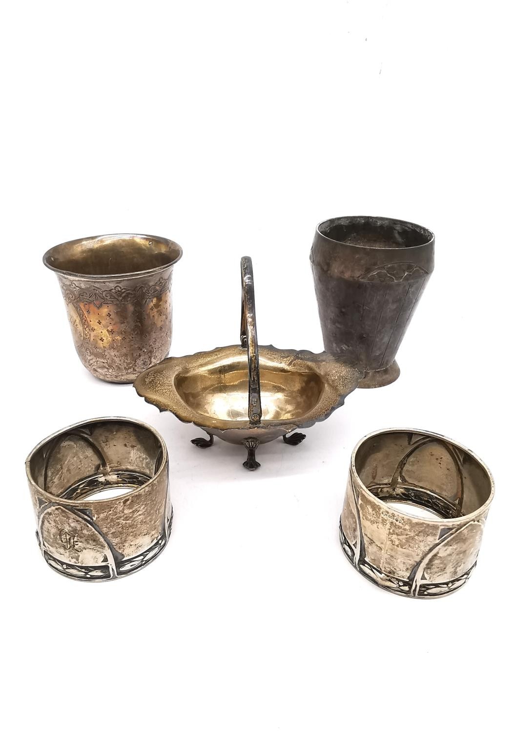 Five pieces of silver and a silver plated Art Deco cup. Two napkin rings by Wilhelm Binder, a