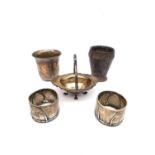Five pieces of silver and a silver plated Art Deco cup. Two napkin rings by Wilhelm Binder, a