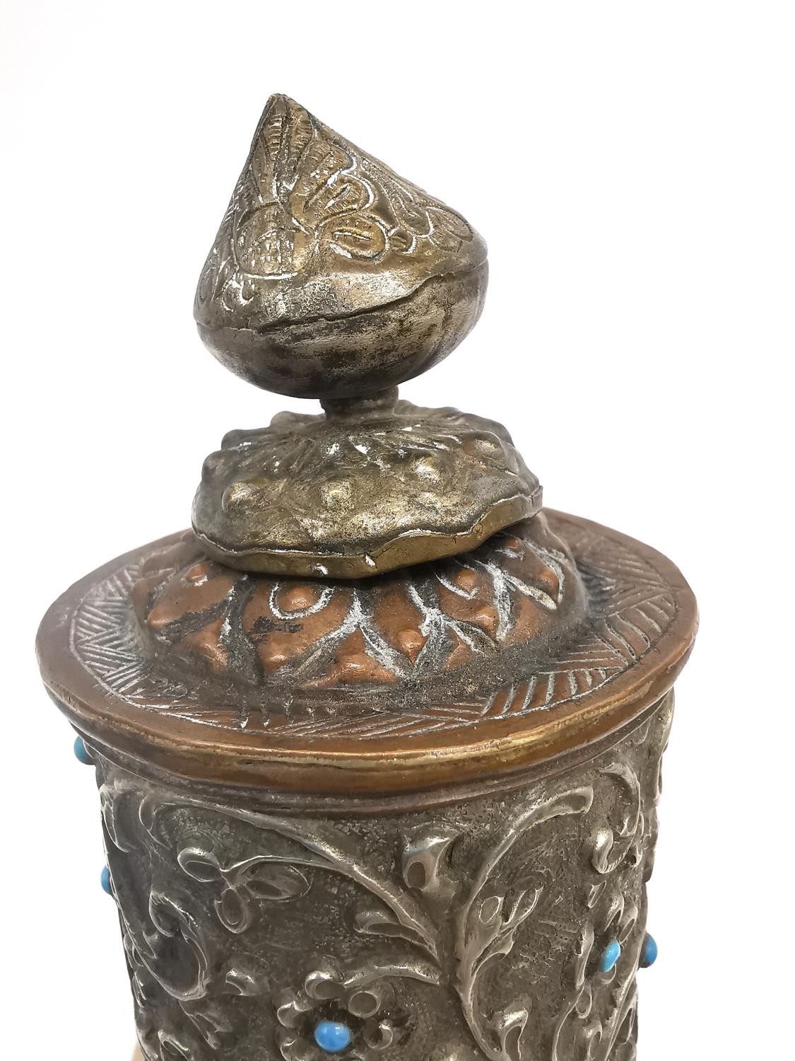 A Tibetan 19th century brass and copper repousse prayer wheel with hardwood handle. H.31cm. - Image 5 of 5