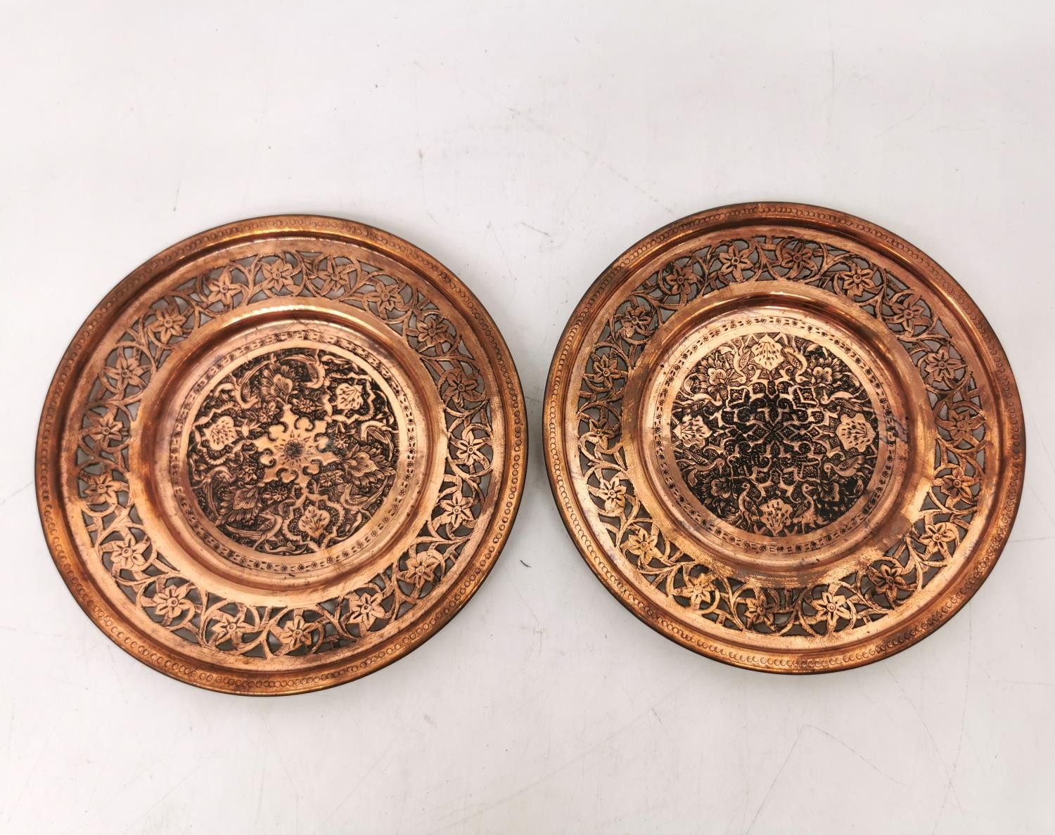 A collection of five early 20th century Persian copper repousse dishes, including a pair of coasters - Image 5 of 5