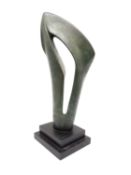 An abstract bronze effect resin sculpture on stepped base. H.41 W.16 D.14cm.