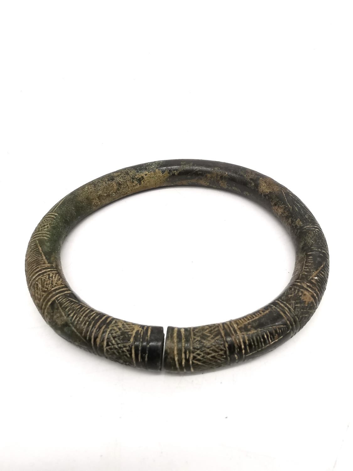An ancient Iranian bronze torque arm bracelet/necklace with incised design. Diameter 12cm, - Image 2 of 6