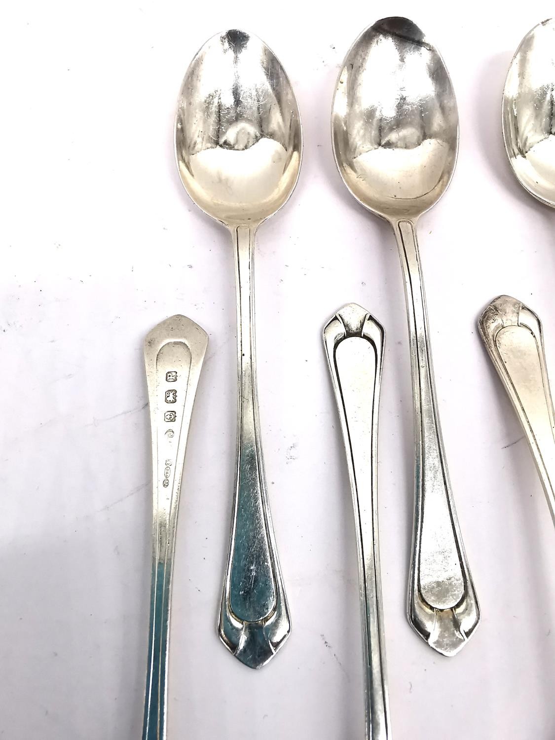 A collection of silver teaspoons, two pairs of sugar tongs, a pickle fork, a small sauce ladle and a - Image 14 of 16