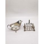 A silver gravy boat by Viners Ltd along with a sterling silver Victorian toast rack by James Dixon &