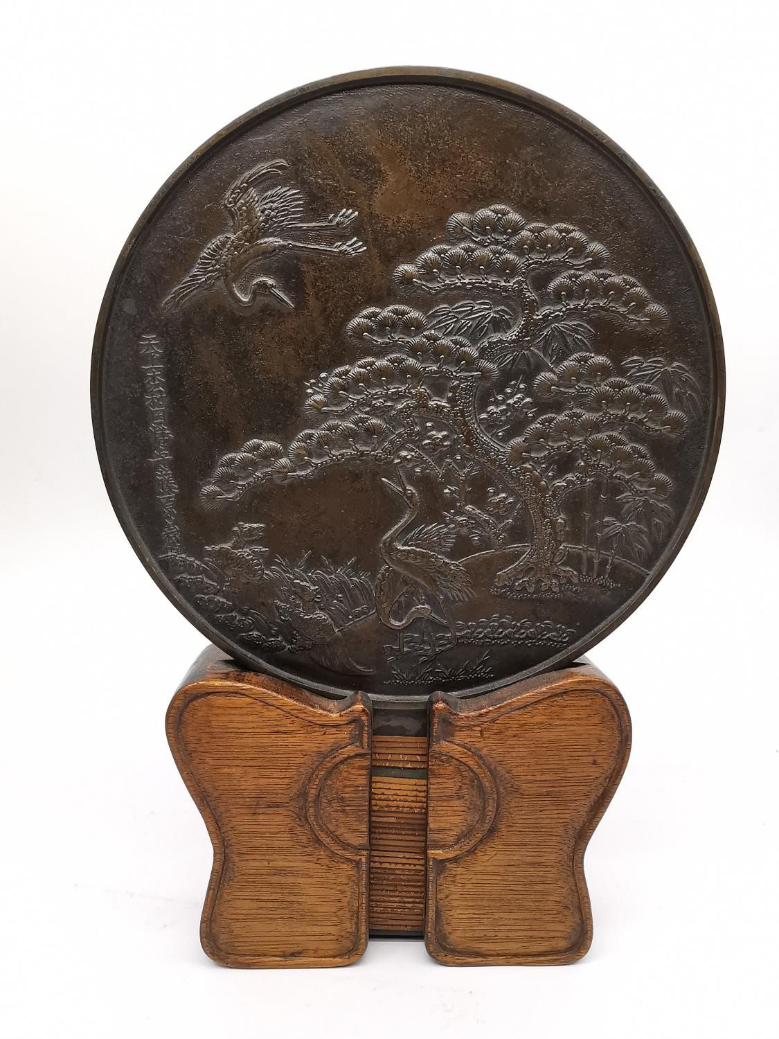 An early 20th century Japanese bronze Kagami mirror on wooden stand, decorated with a pine tree - Image 3 of 9