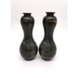 A pair of 19th century bronze Japanese double gourde vases incised with prunus branches and inlaid