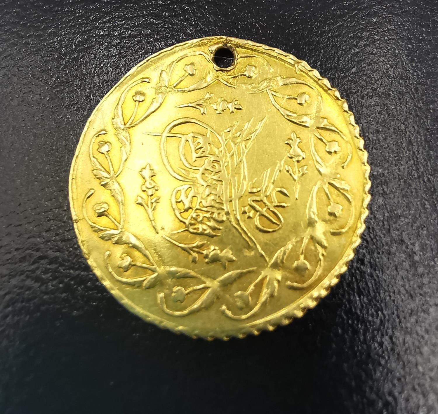 A Turkish 1 cedid gold coin, Mahmud II (1808-1839). (holed), Diameter 2cm. Weight 1.54g. - Image 2 of 3